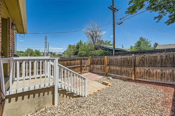 a view of a fence and trees