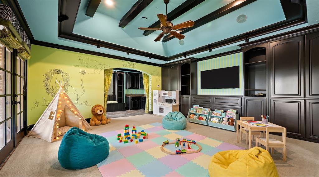 6900 Rockingham Court Colleyville, TX 76034 - Photo 19 of 40 PlayRoom/Game Room is versatile. Has its own walk-out balcony with double doors, en-suite 1/2 bathroom, and wet bar. Ai staged.