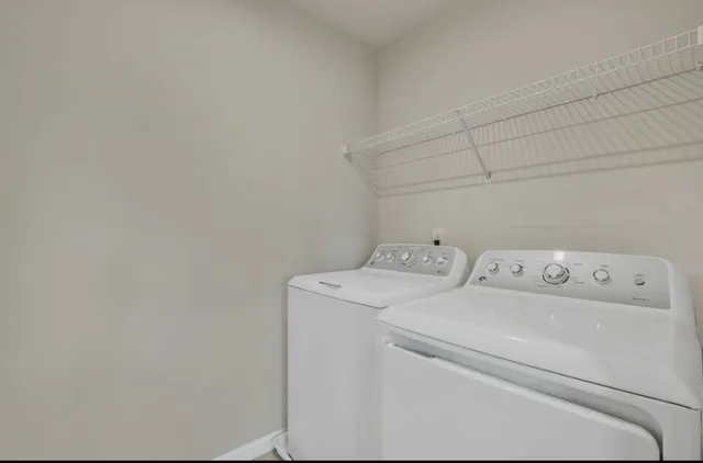 a utility room with dryer and washer