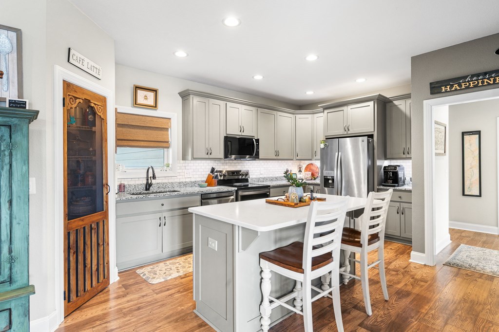 958 New Forest Road Young Harris, GA 30582 - Photo 18 of 44 a kitchen that has a lot of cabinets in it and stainless steel appliances