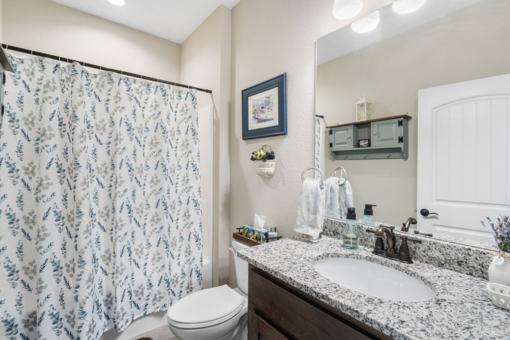 958 New Forest Road Young Harris, GA 30582 - Photo 28 of 44 a bathroom with a granite countertop sink toilet and shower