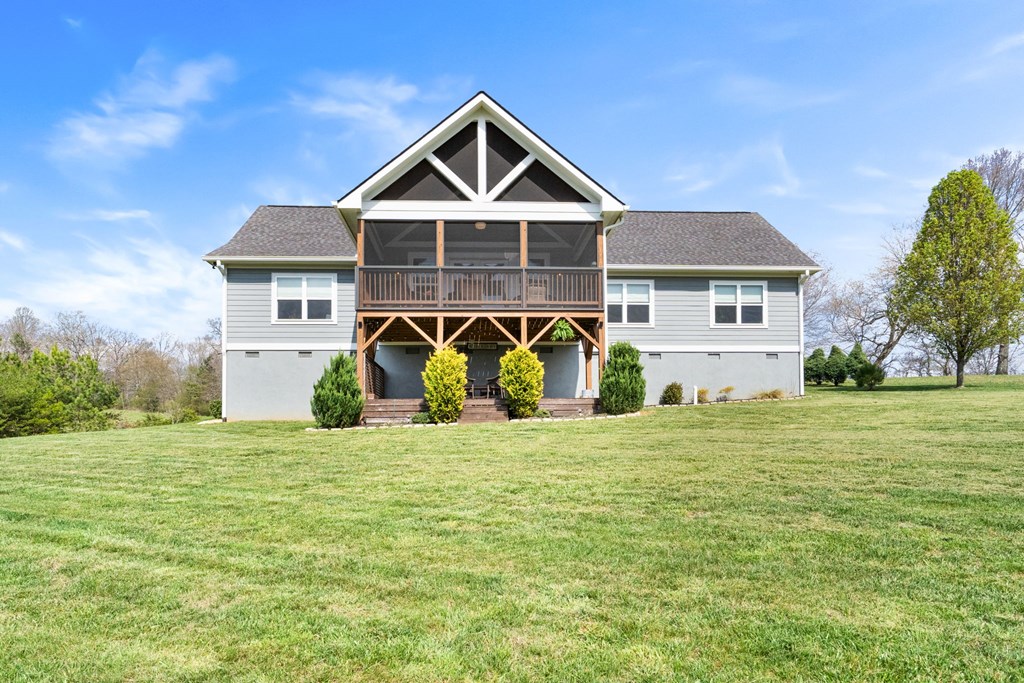 958 New Forest Road Young Harris, GA 30582 - Photo 5 of 44 a front view of a house with a garden