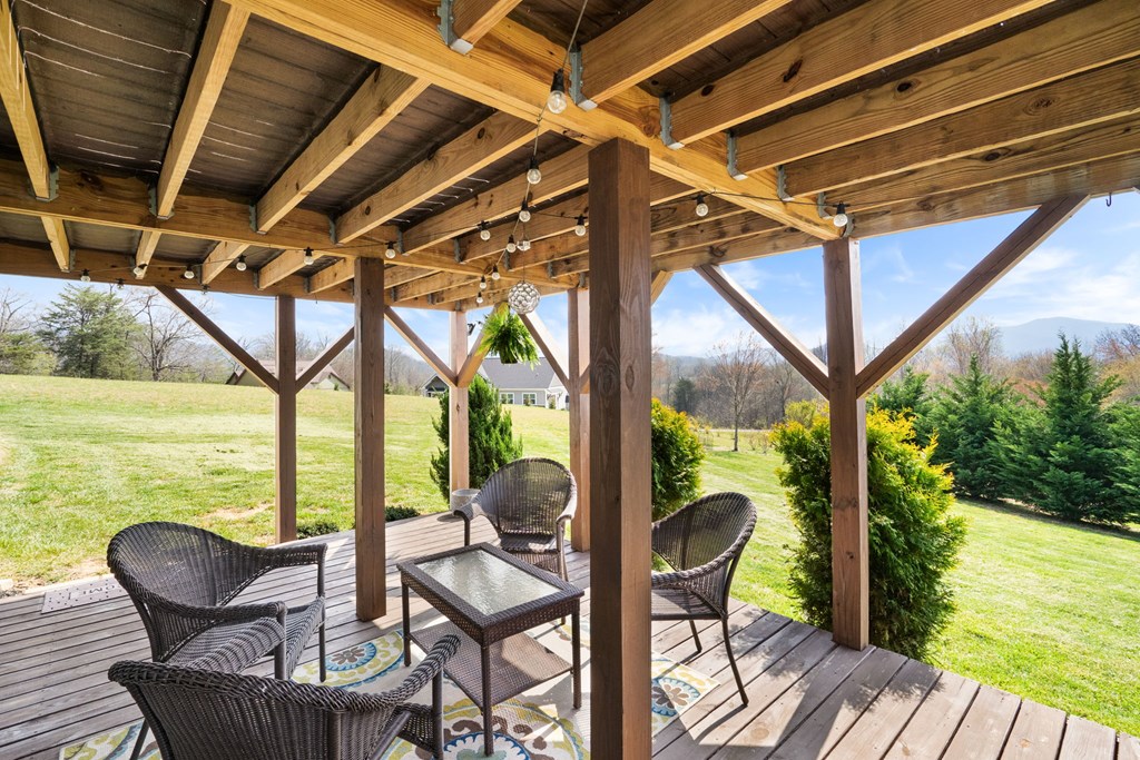 958 New Forest Road Young Harris, GA 30582 - Photo 8 of 44 a view of chair and table in the balcony