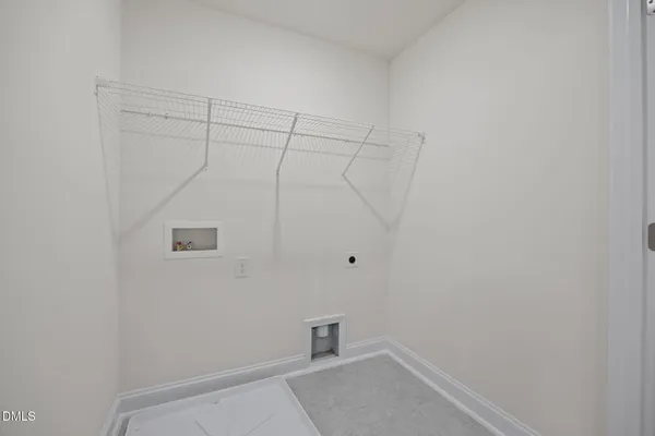 a room with a white wall