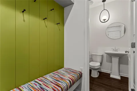 a bathroom with a sink toilet and vanity