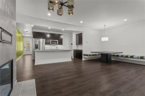 a view of a kitchen with microwave and cabinets