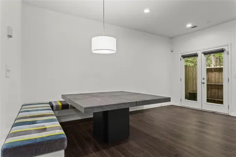 a room with wooden floor and outdoor space