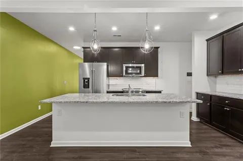 a view of a kitchen counter top space a sink and dishwasher