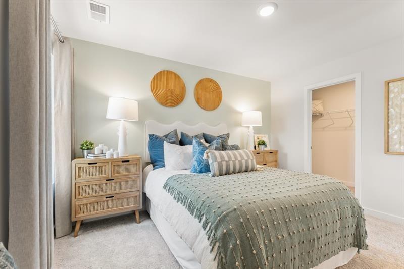 1707 Harper Lily Lane Lawrenceville, GA 30043 - Photo 18 of 43 a bed room with a bed and dresser