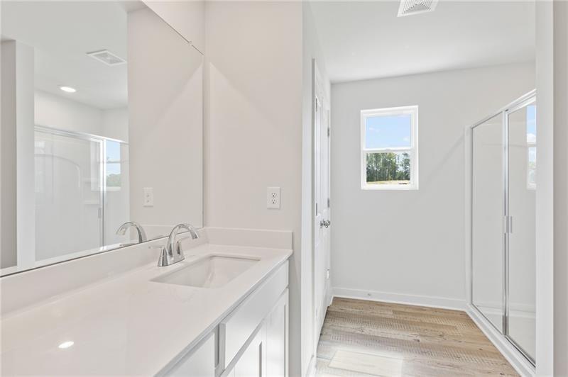 1707 Harper Lily Lane Lawrenceville, GA 30043 - Photo 34 of 43 a bathroom with a sink and a mirror
