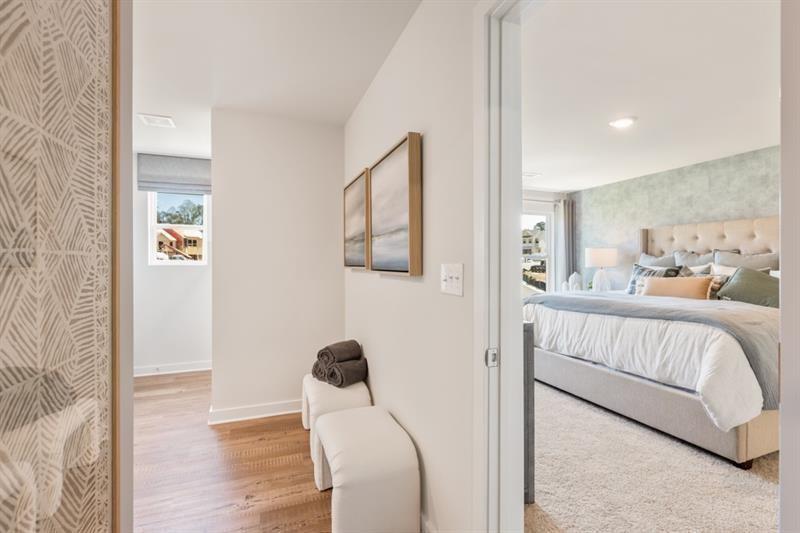 1707 Harper Lily Lane Lawrenceville, GA 30043 - Photo 41 of 43 a bedroom with a bed and a mirror