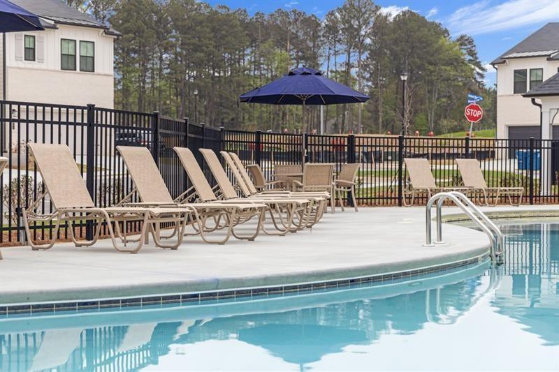 1707 Harper Lily Lane Lawrenceville, GA 30043 - Photo 5 of 43 a view of a lake with a patio