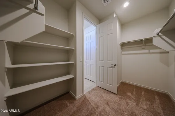 a view of an empty walk in closet
