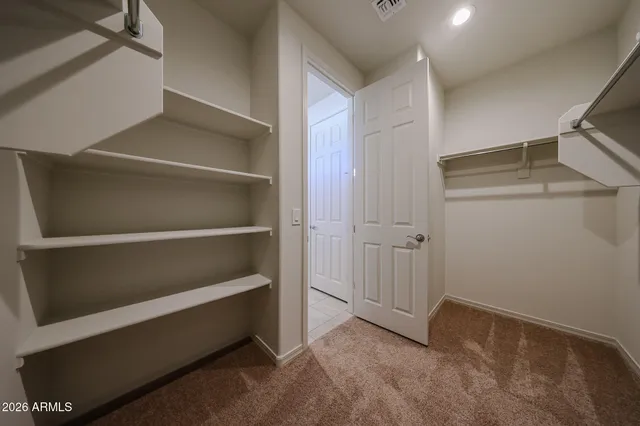 a view of an empty walk in closet