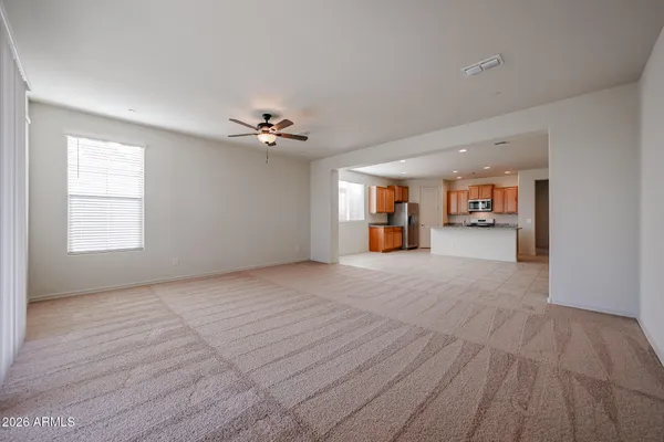 a view of a livingroom with furniture and a stove