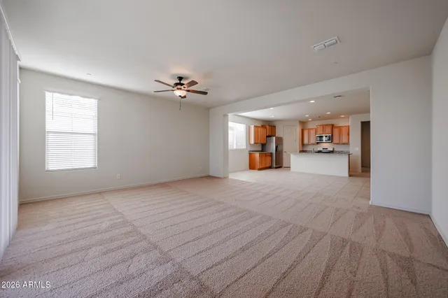 a view of a livingroom with furniture and a stove