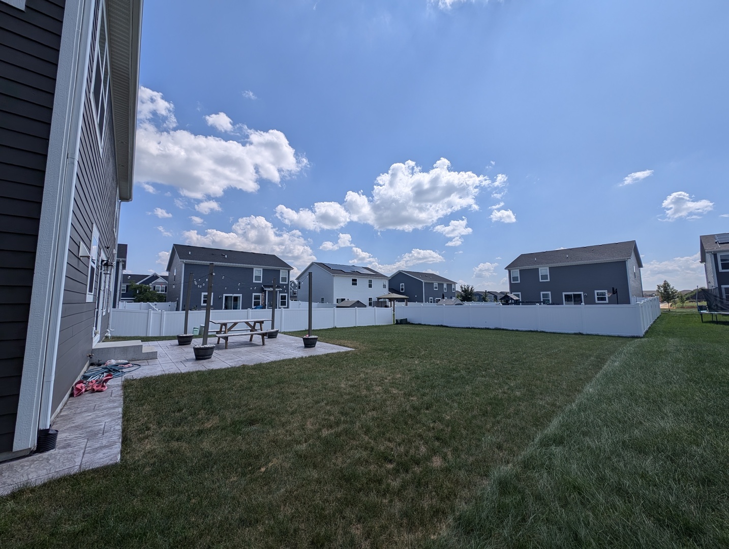 3759 St James Court Elgin, IL 60124 - Photo 12 of 28 a view of a house with a big yard and large trees