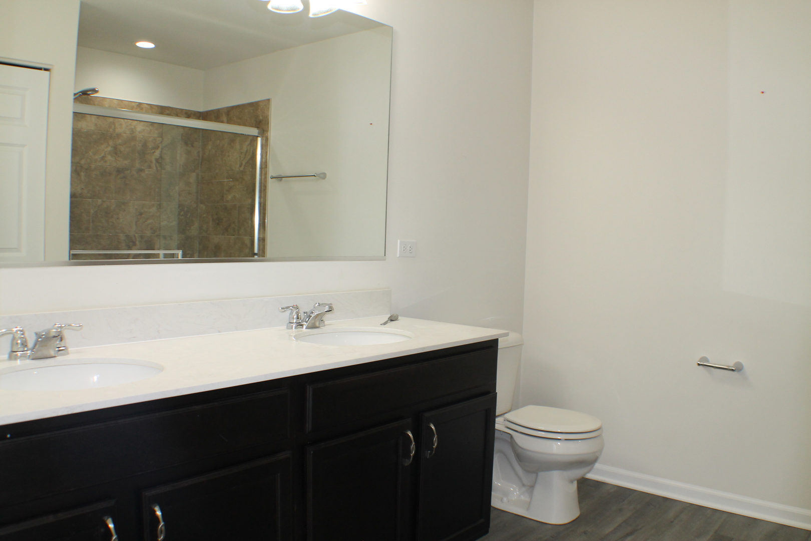 3759 St James Court Elgin, IL 60124 - Photo 23 of 28 a bathroom with a sink and a toilet