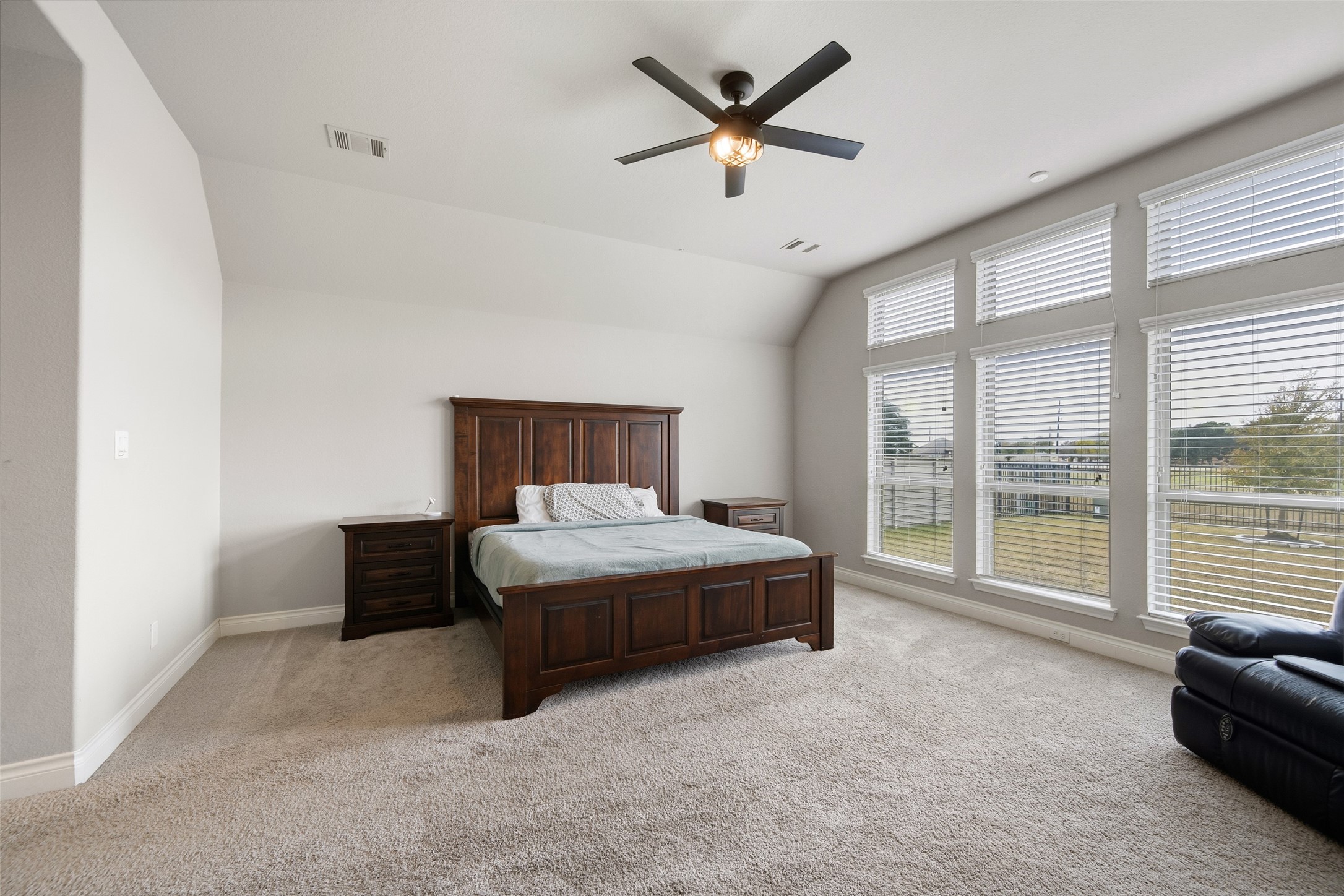 1934 Bayleaf Manor Drive Manvel, TX 77578 - Photo 25 of 37 a spacious bedroom with a bed and a large window