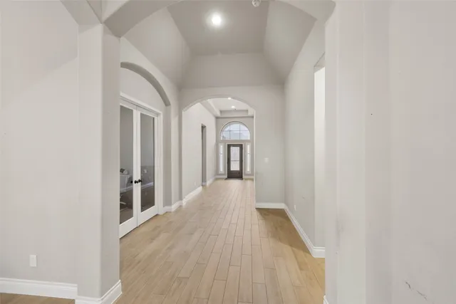a view of a hallway with a white walls