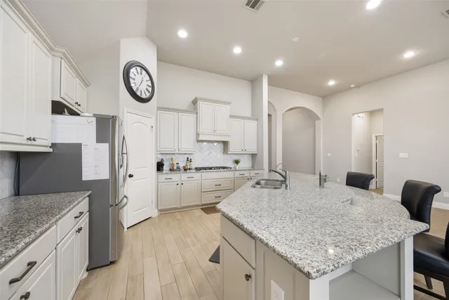 a kitchen with a stove oven and a refrigerator