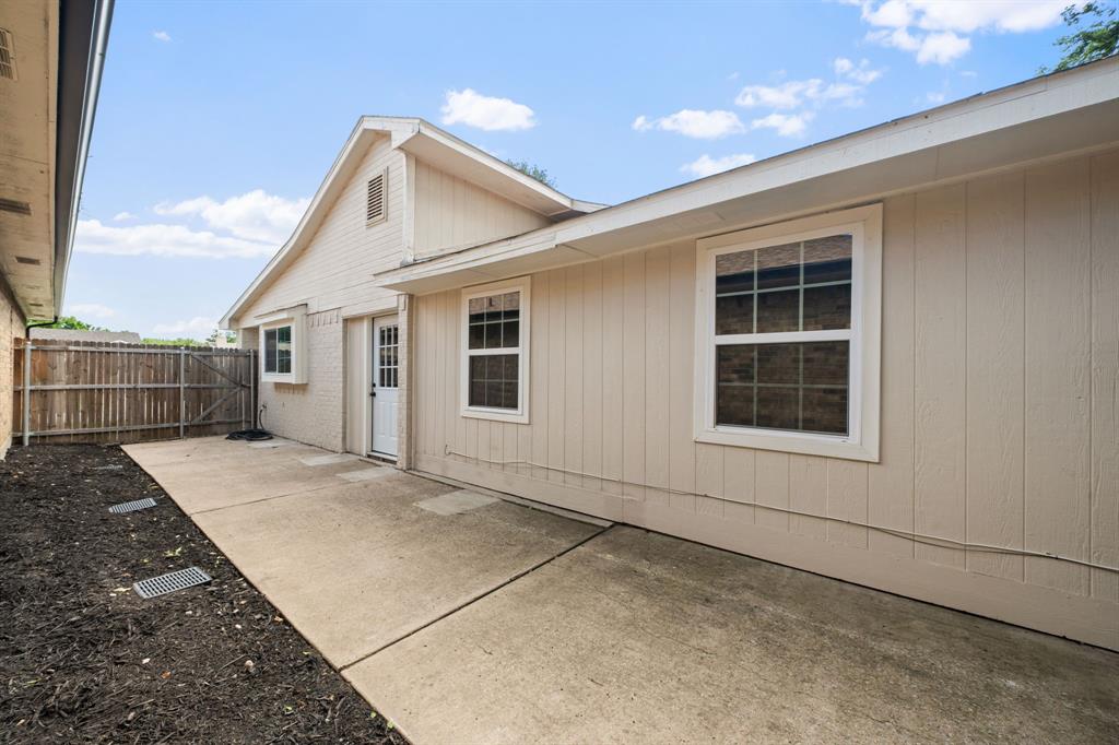 310 Valley Spring Drive Arlington, TX 76018 - Photo 22 of 24 Expansive concrete patio with direct access to the interior
