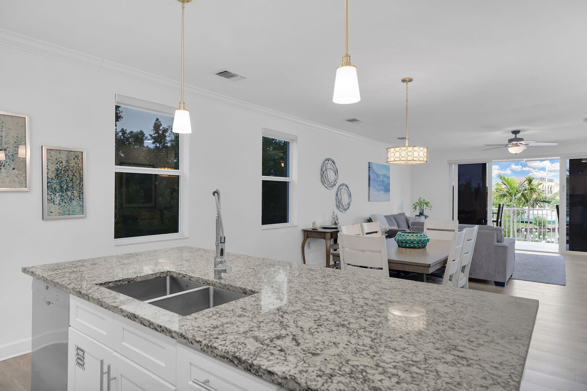 451 Sombrero Beach Road Marathon, FL 33050 - Photo 15 of 55 a kitchen island with a sink and living room view