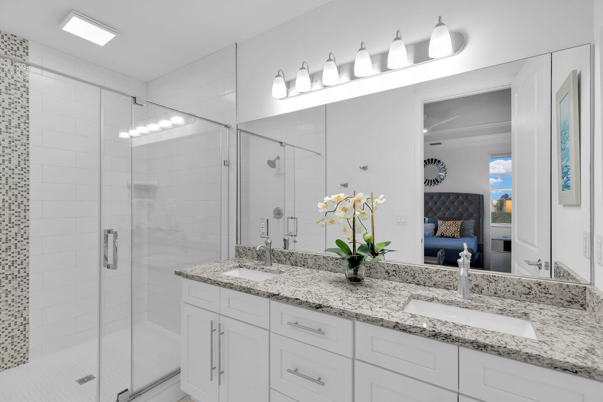 451 Sombrero Beach Road Marathon, FL 33050 - Photo 20 of 55 a bathroom with a granite countertop sink and a mirror