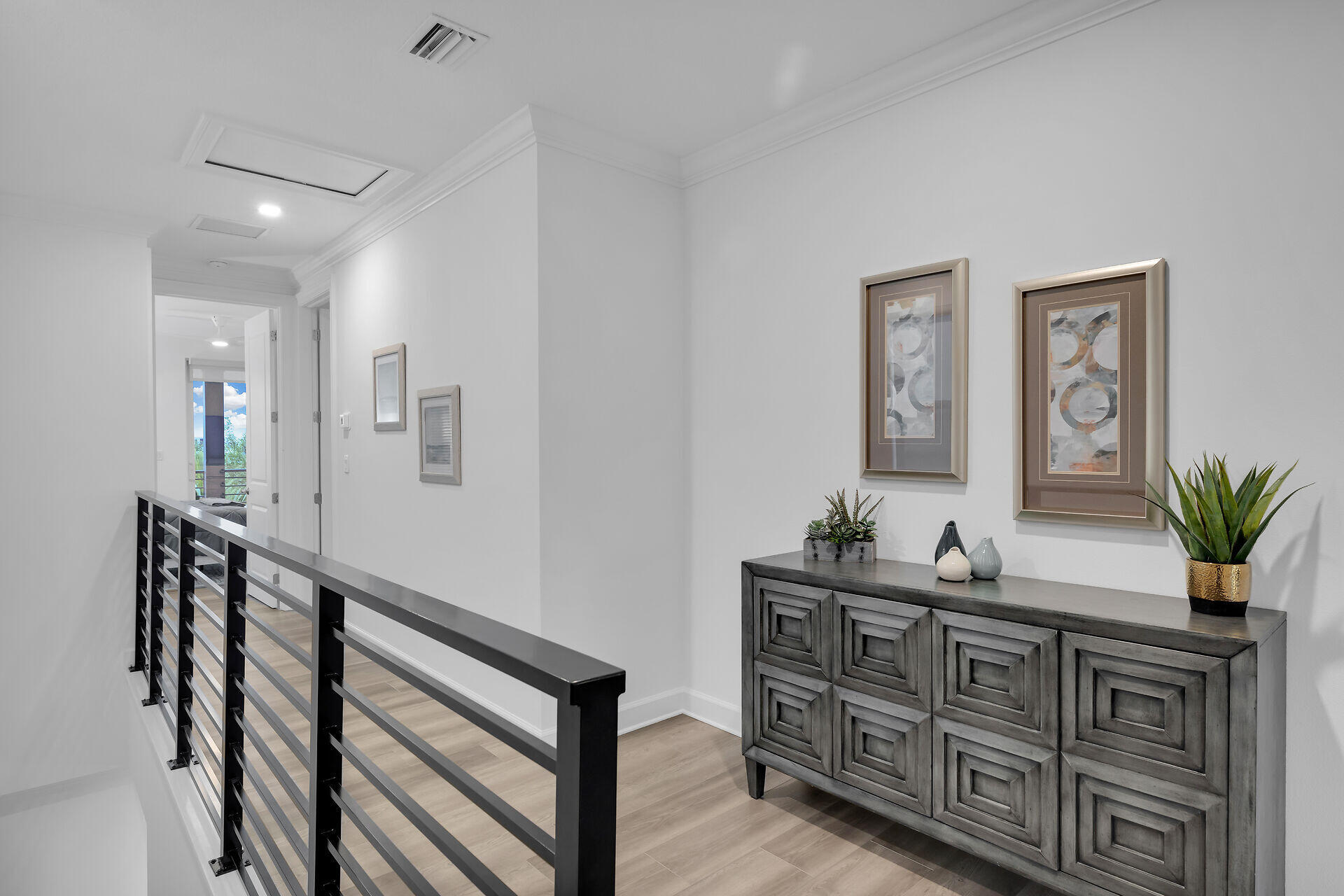 451 Sombrero Beach Road Marathon, FL 33050 - Photo 21 of 55 a spacious bedroom with a table and a potted plant