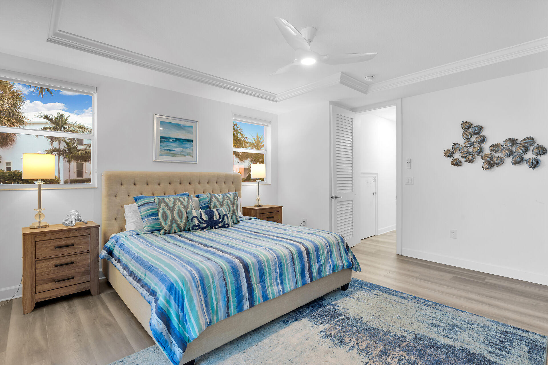 451 Sombrero Beach Road Marathon, FL 33050 - Photo 22 of 55 a bedroom with a bed and dresser with wooden floor