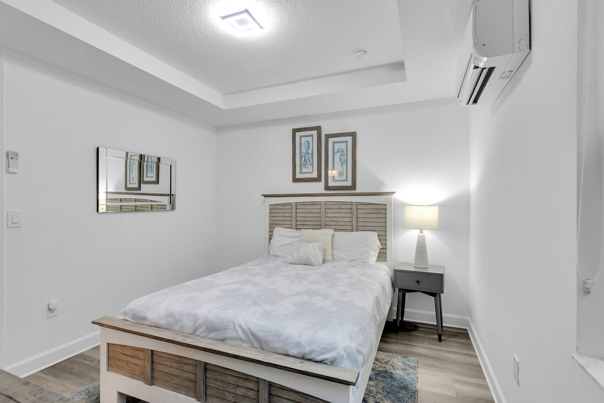 451 Sombrero Beach Road Marathon, FL 33050 - Photo 26 of 55 a bedroom with a bed and a lamp on the dresser