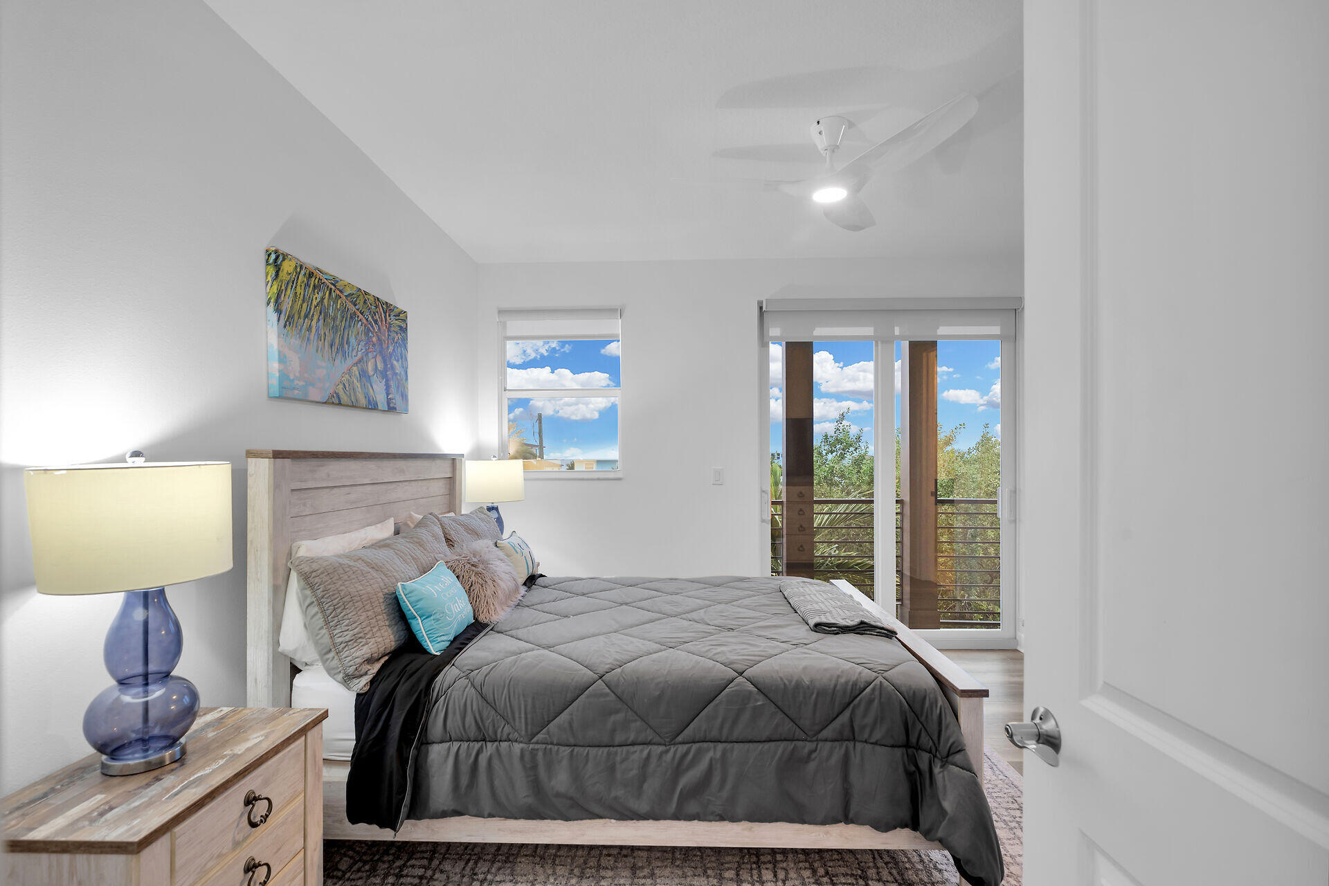 451 Sombrero Beach Road Marathon, FL 33050 - Photo 28 of 55 a bedroom with a bed and lamp