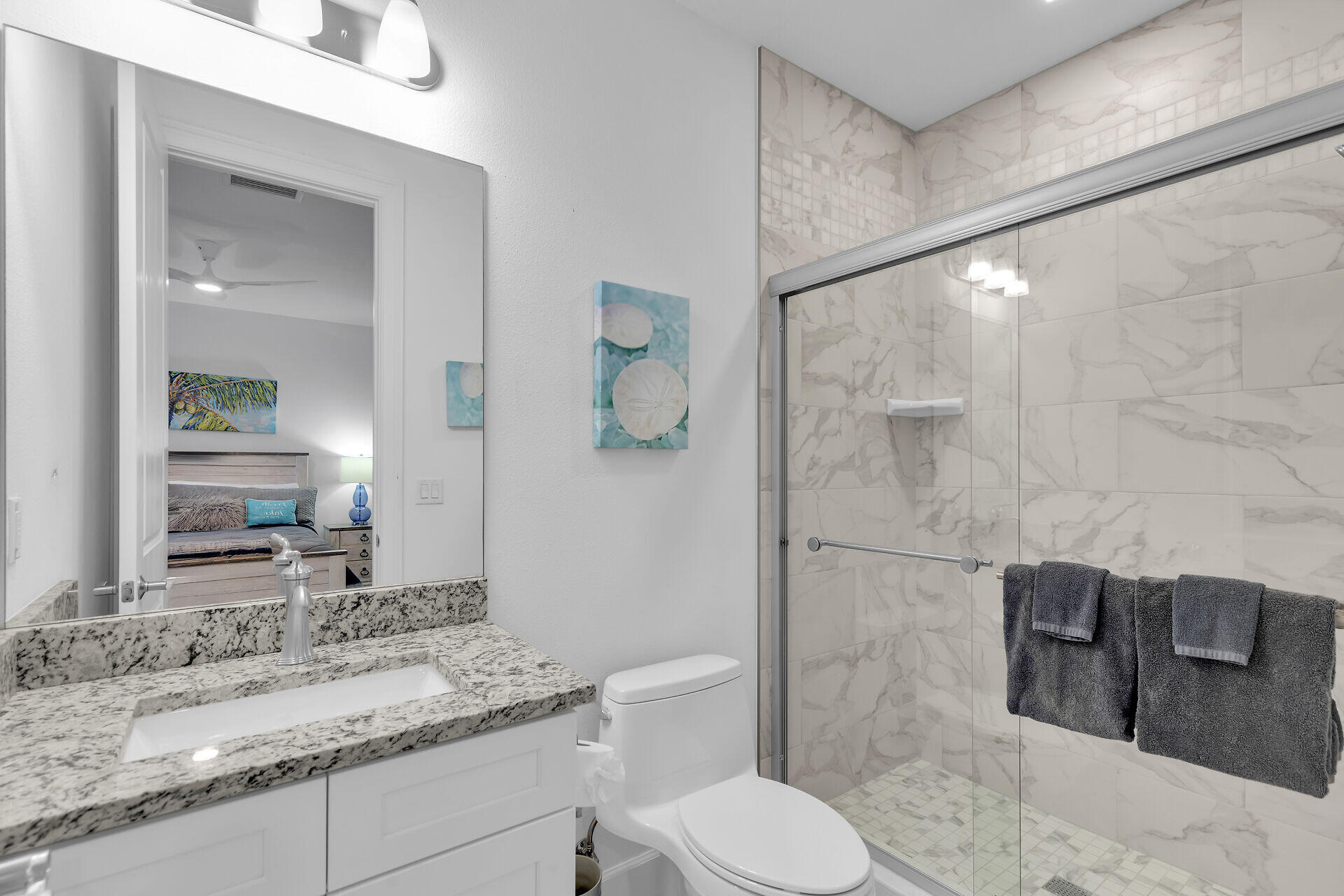 451 Sombrero Beach Road Marathon, FL 33050 - Photo 32 of 55 a bathroom with a granite countertop sink toilet and shower