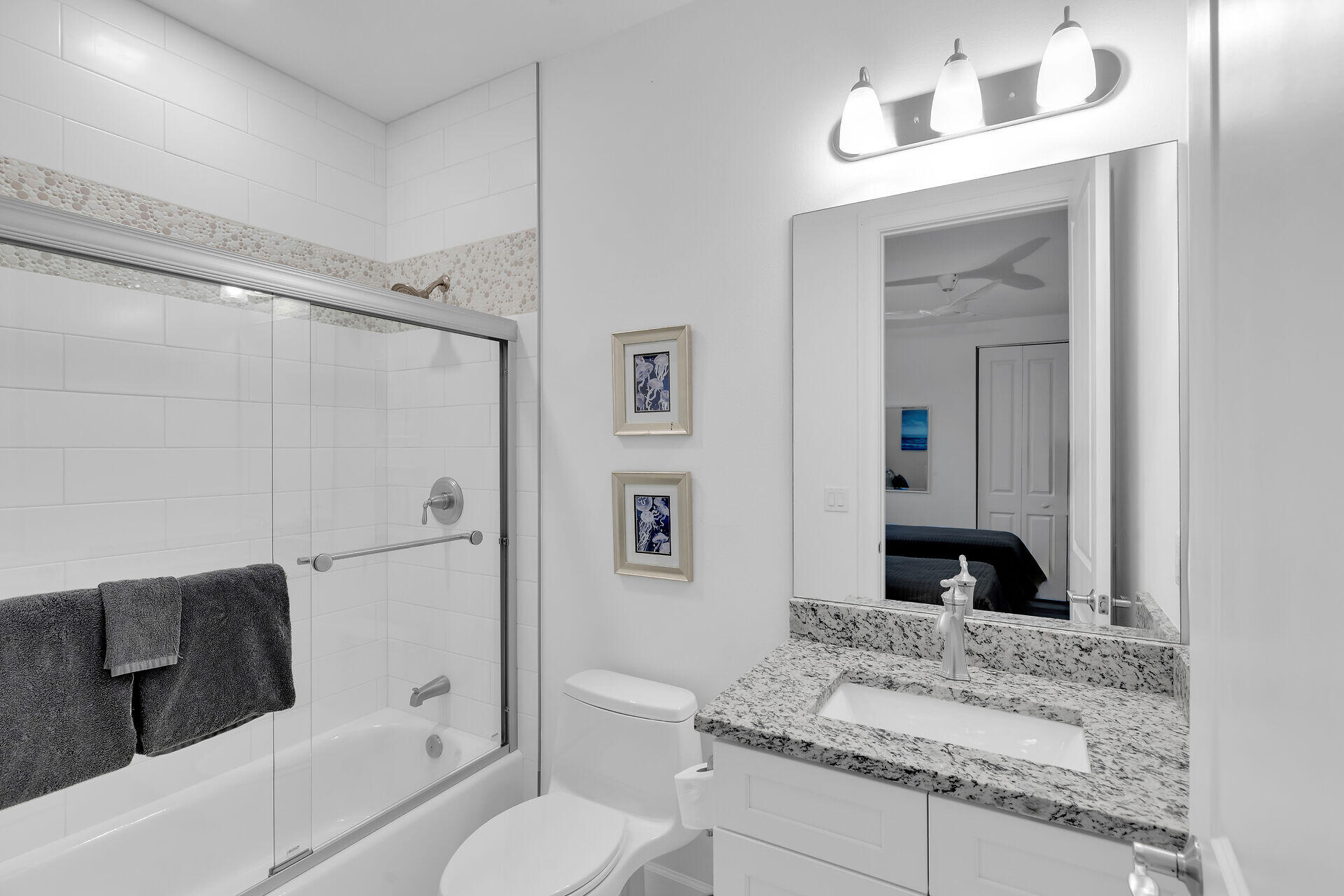 451 Sombrero Beach Road Marathon, FL 33050 - Photo 35 of 55 a bathroom with a granite countertop sink toilet and shower