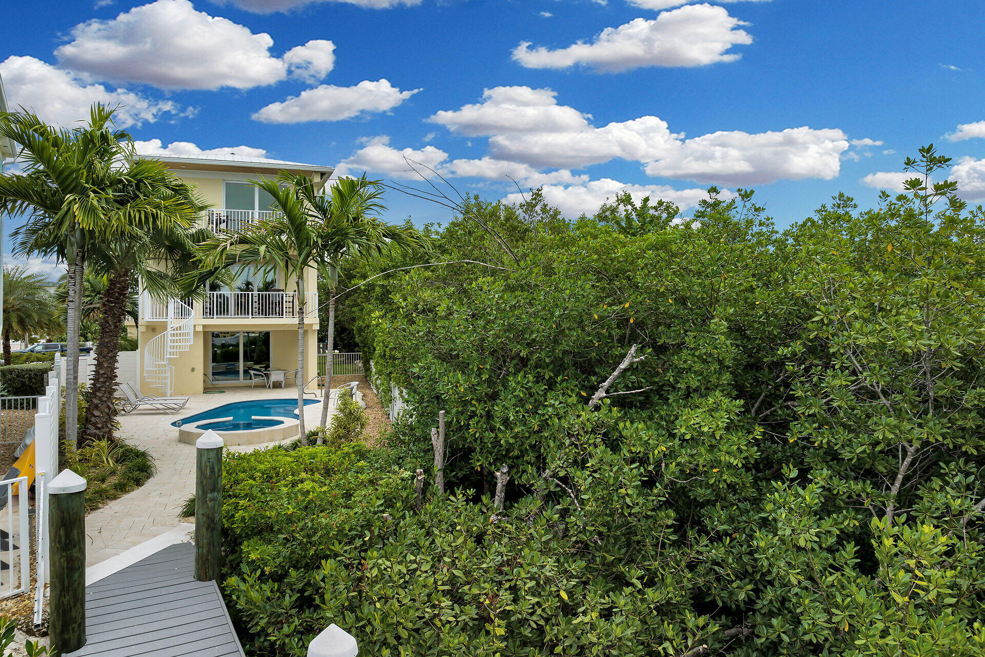 451 Sombrero Beach Road Marathon, FL 33050 - Photo 36 of 55 a front view of a house with garden