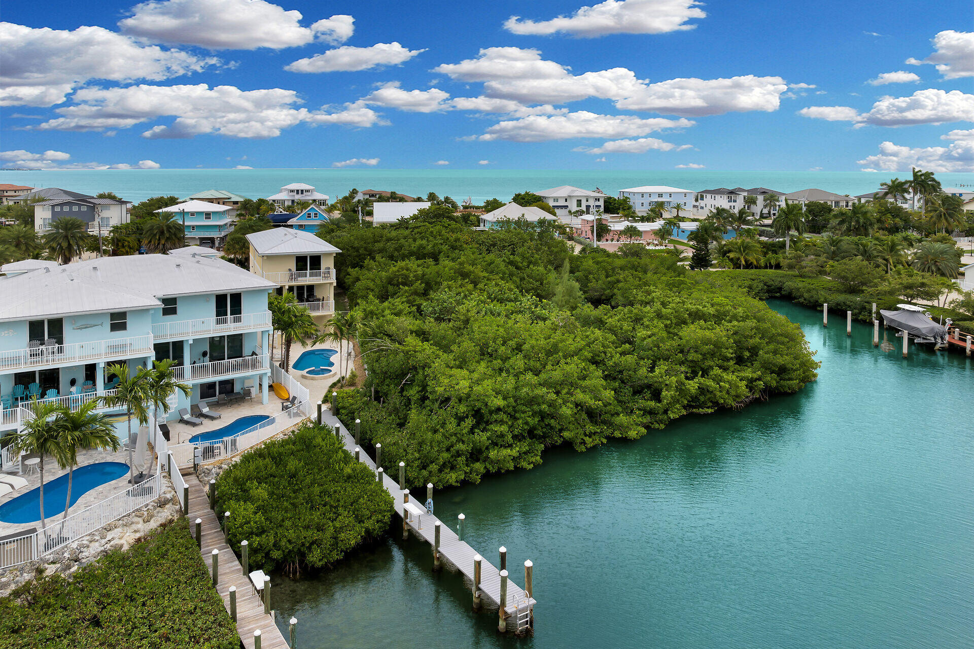 451 Sombrero Beach Road Marathon, FL 33050 - Photo 44 of 55 an aerial view of a house with a yard lake view and boat