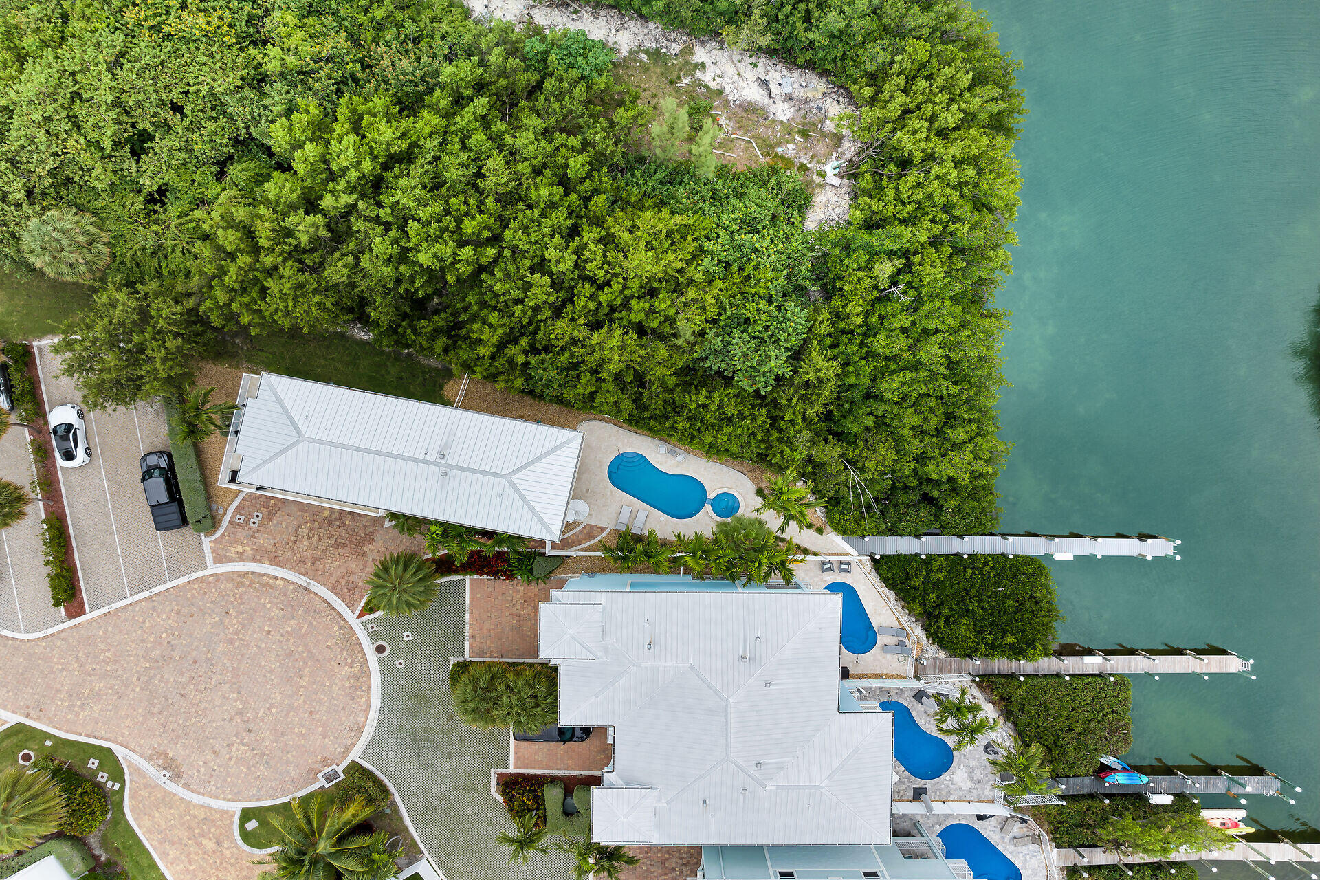 451 Sombrero Beach Road Marathon, FL 33050 - Photo 47 of 55 an aerial view of a house with outdoor space pool seating area and yard