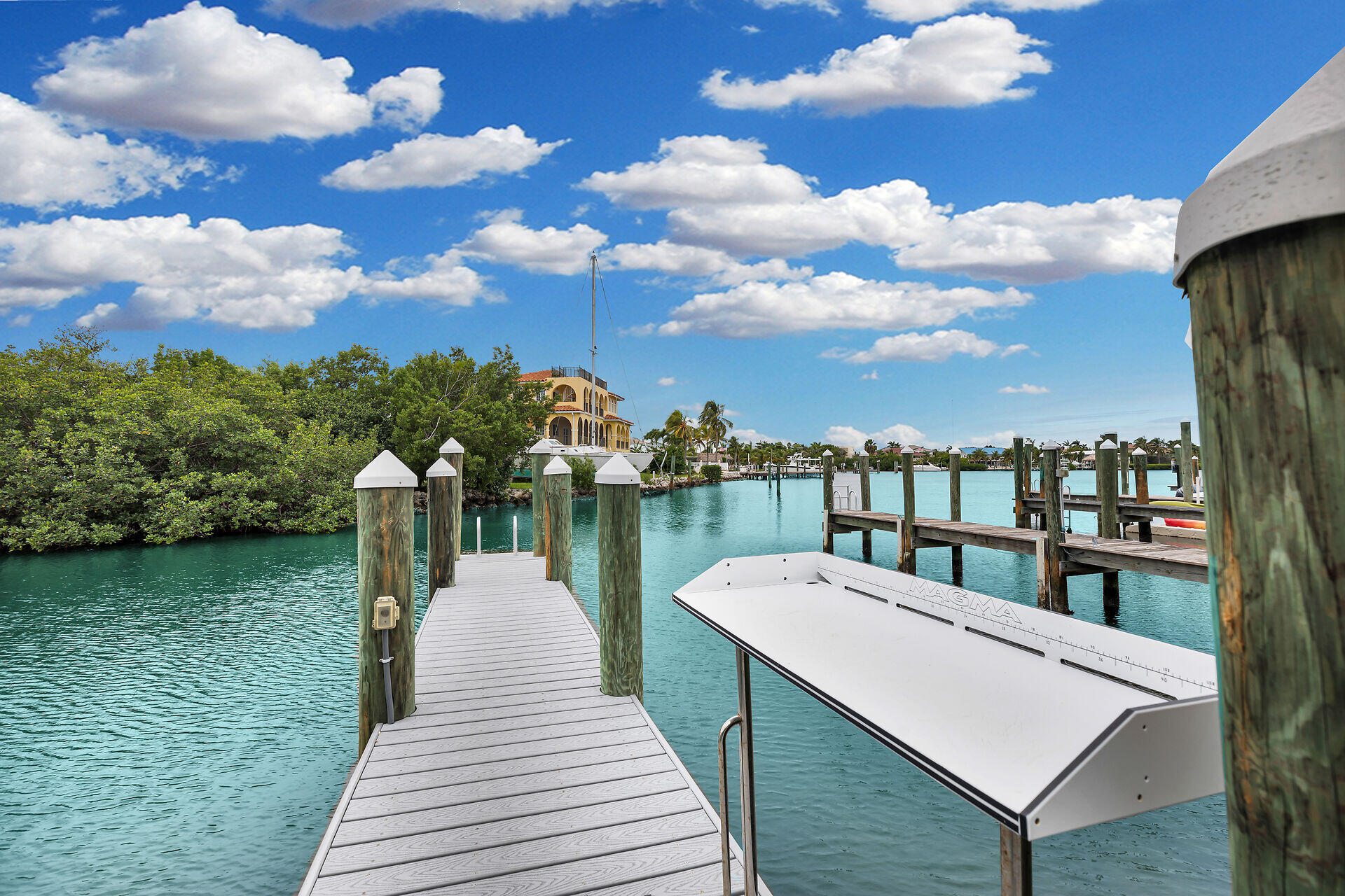 451 Sombrero Beach Road Marathon, FL 33050 - Photo 48 of 55 a view of a lake with a bench in front of house
