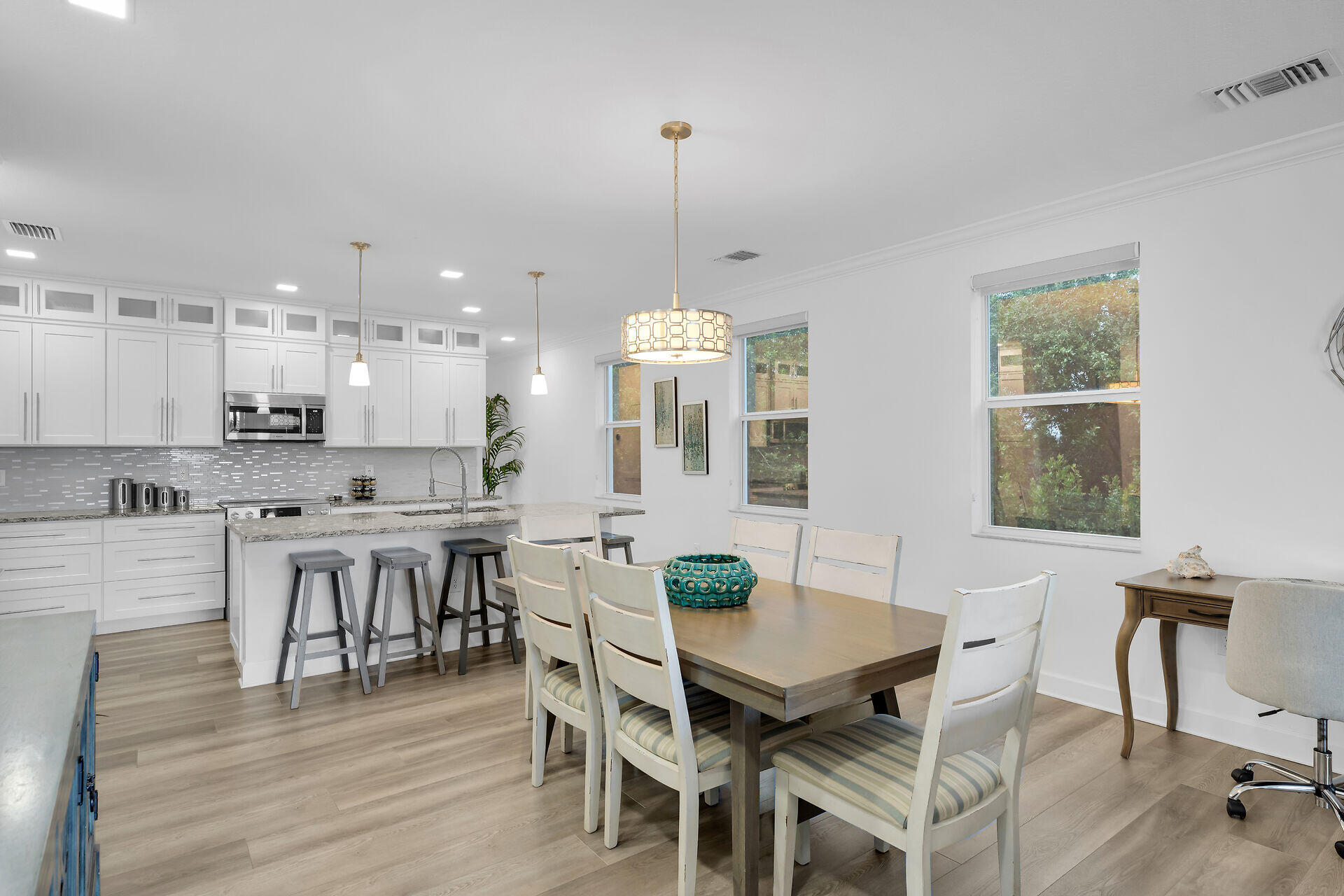 451 Sombrero Beach Road Marathon, FL 33050 - Photo 10 of 55 a view of a dining room with furniture and wooden floor