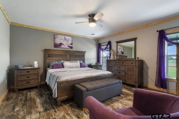 a bedroom with a bed and furniture