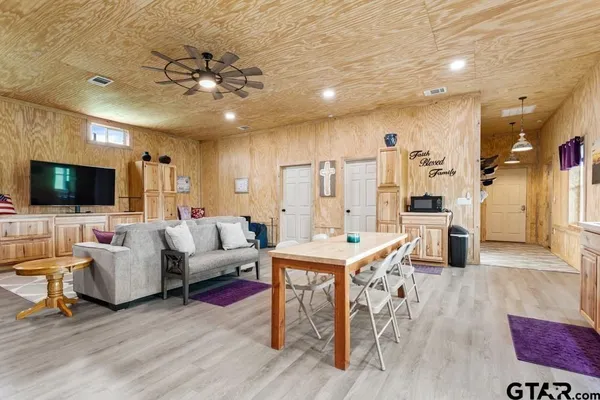 a kitchen that has a table and chairs in it
