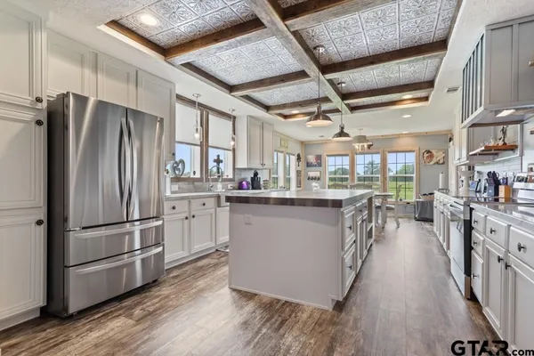 a kitchen with refrigerator and countertop