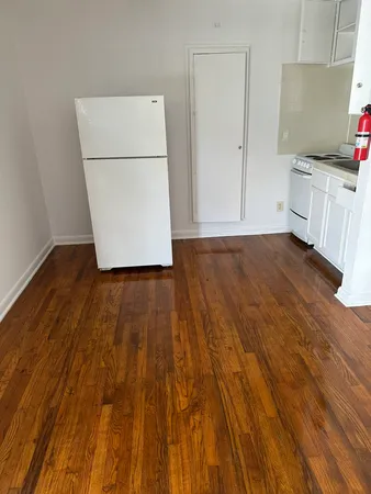 a view of a kitchen with wooden floor