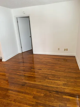 a view of room and wooden floor