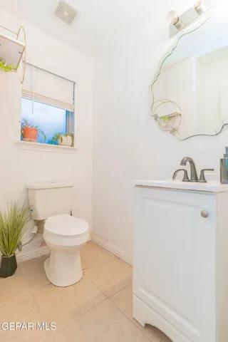 a bedroom with a bed and a television