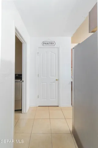 a view of a hallway with wooden floor and entryway