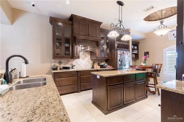 a kitchen with a sink and wooden cabinets