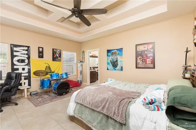 a bedroom with a bed a couch and a window