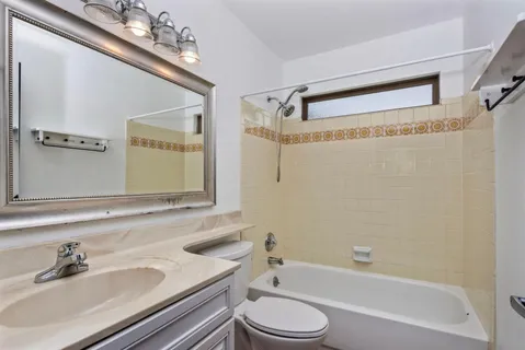 a bathroom with a sink a toilet and a bathtub
