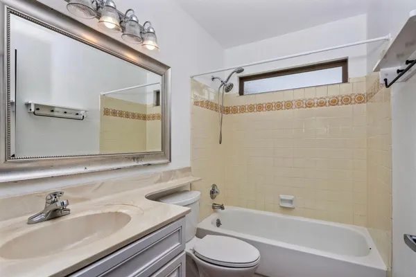 a bathroom with a sink a toilet and a bathtub